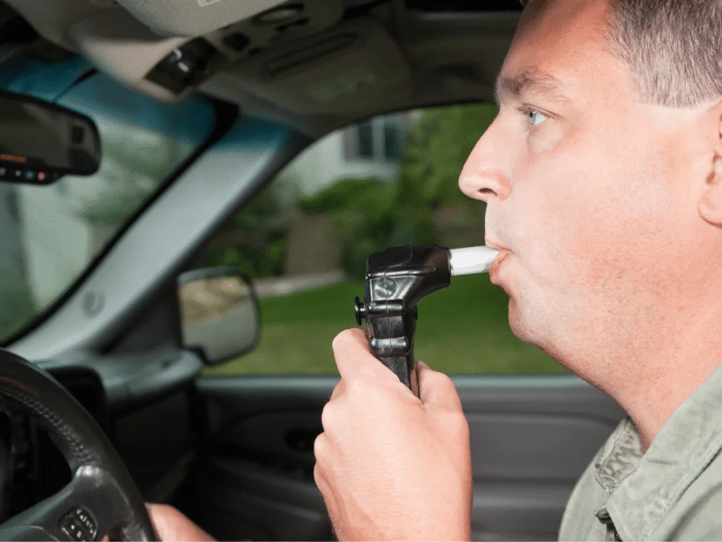 Driver using a certified ignition interlock device inside a vehicle