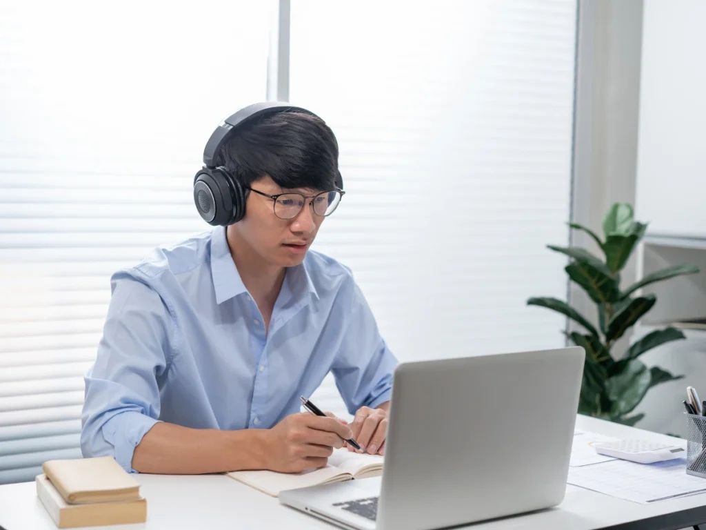 A man taking his online DUI classes on a laptop.